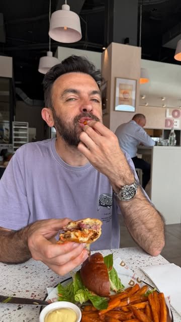 A customer eating at a Lode table