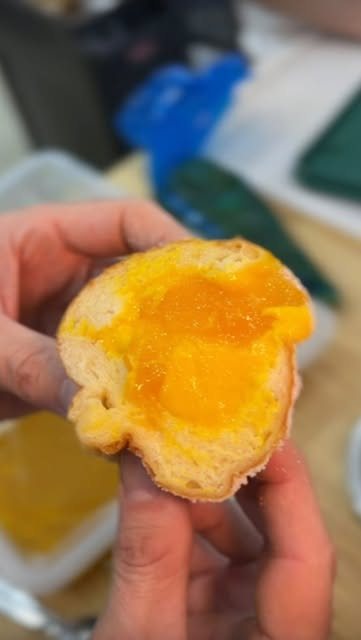 A filled doughnut broken open
