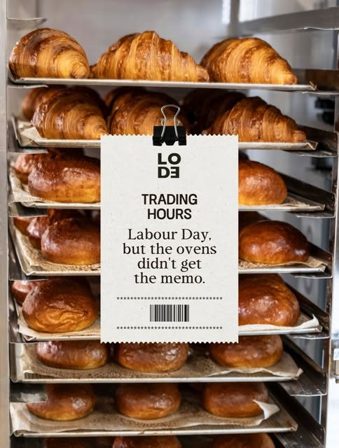Trays of croissants with a Lode trading hours tag